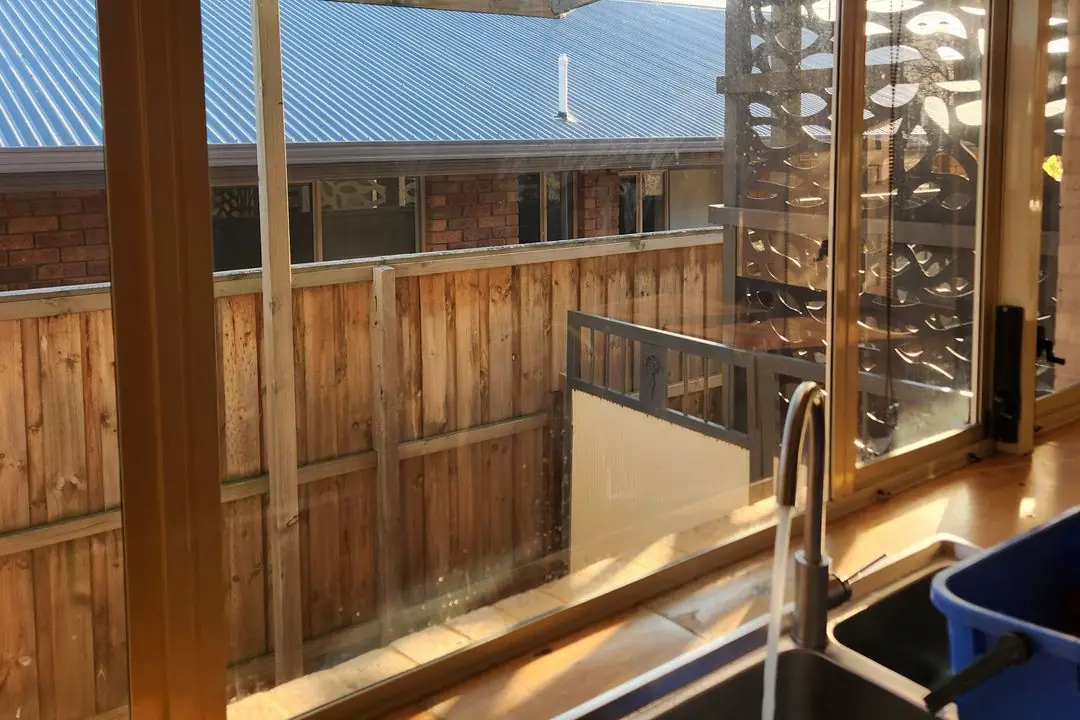 Clean kitchen window above the sink after window cleaning