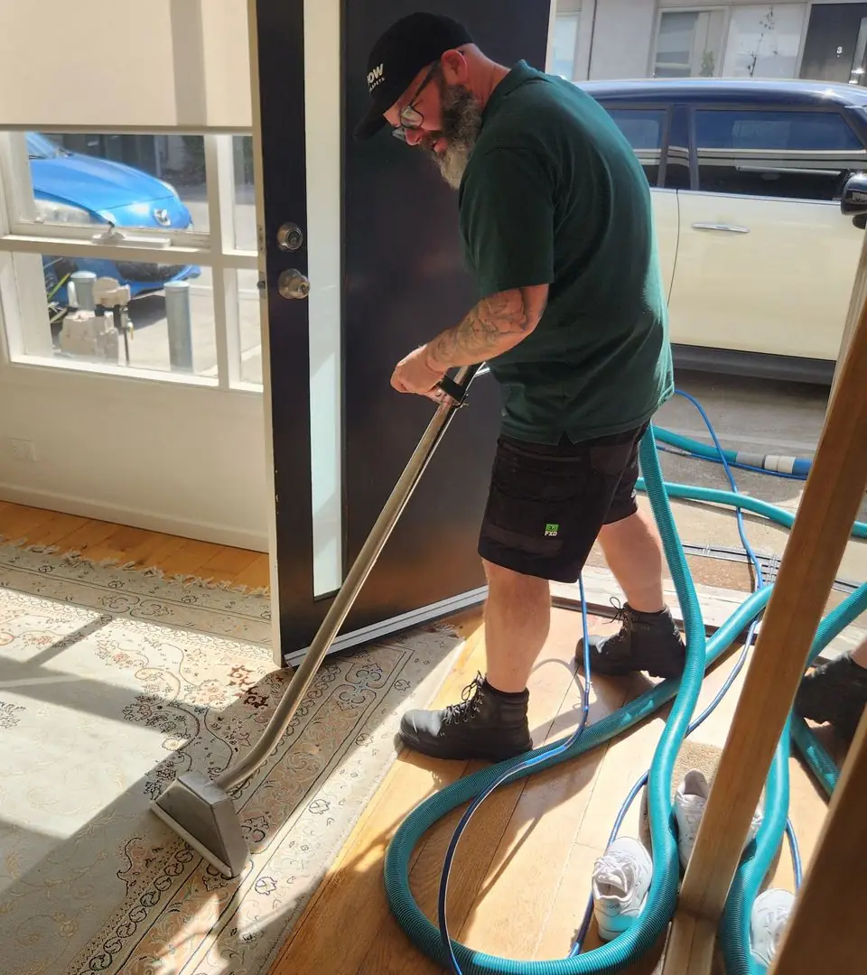 Rodney Driessen cleaning with a hot water extraction wand